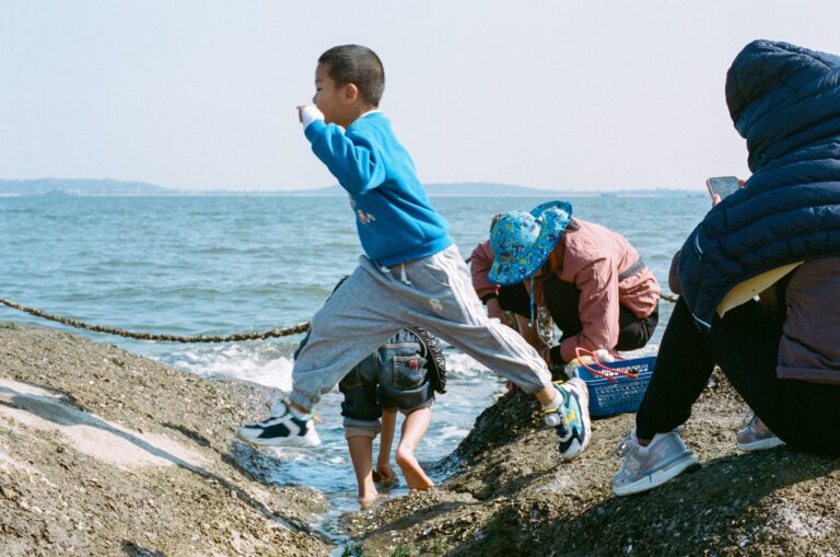Kid Jumping in the Rocks